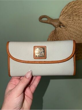 Dooney & Bourke Cream Wallet with Tan Trim and Logo Plaque